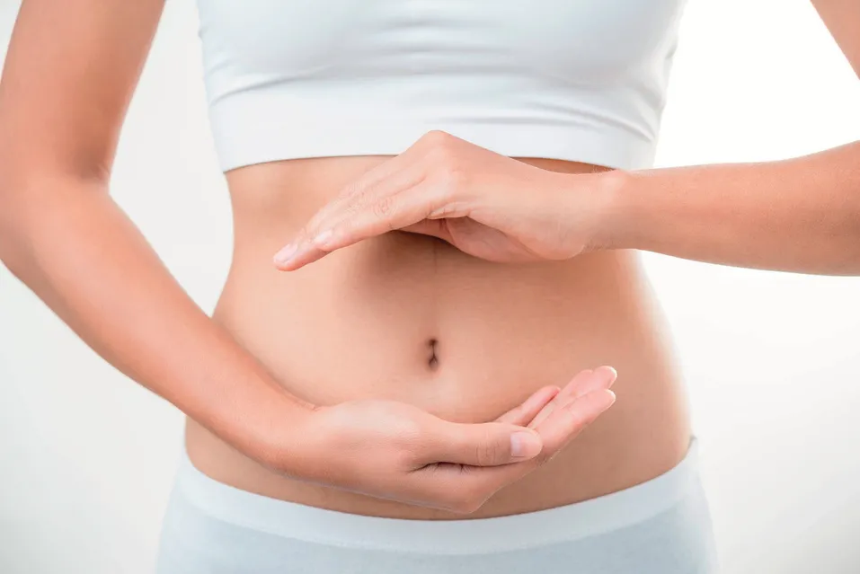 Person holding their stomach, comfortable and at ease